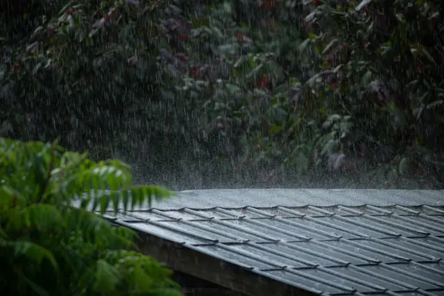 Storm clouds over a home roof before or after severe weather